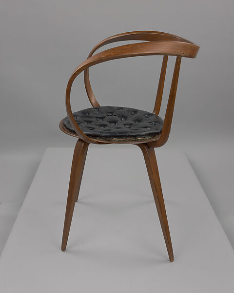 "Pretzel" Armchair, George Nelson (American, 1908–1986), Laminated birch plywood, walnut veneer