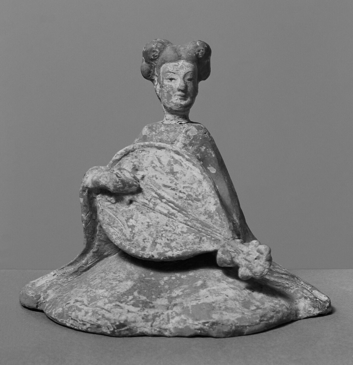 Female musician with lute, Earthenware with pigment, China 