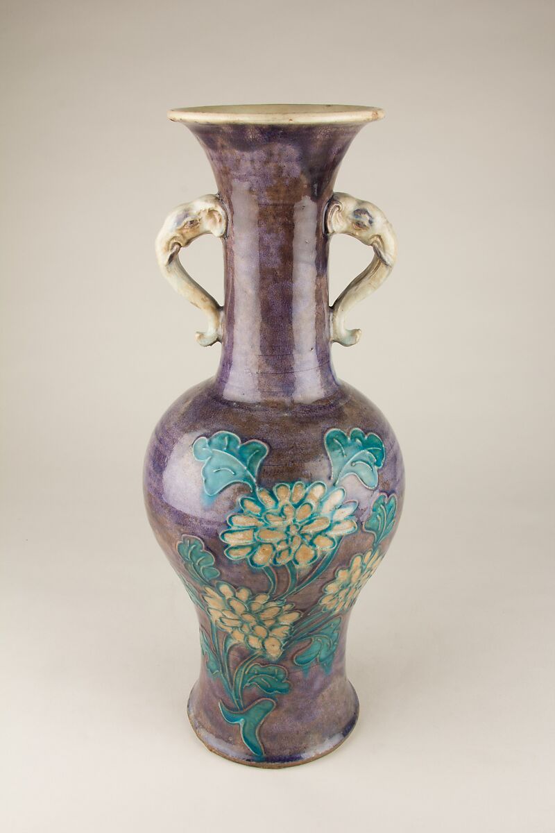 Vase with elephant head handles and floral decoration, Stoneware with relief decoration and polychrome glaze, China 