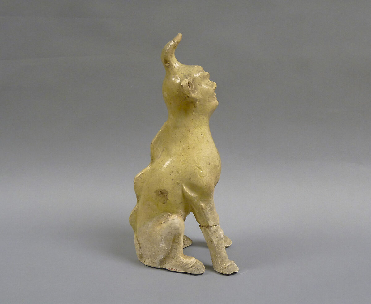 Tomb guardian beasts with dog, Earthenware with pale green glaze, China