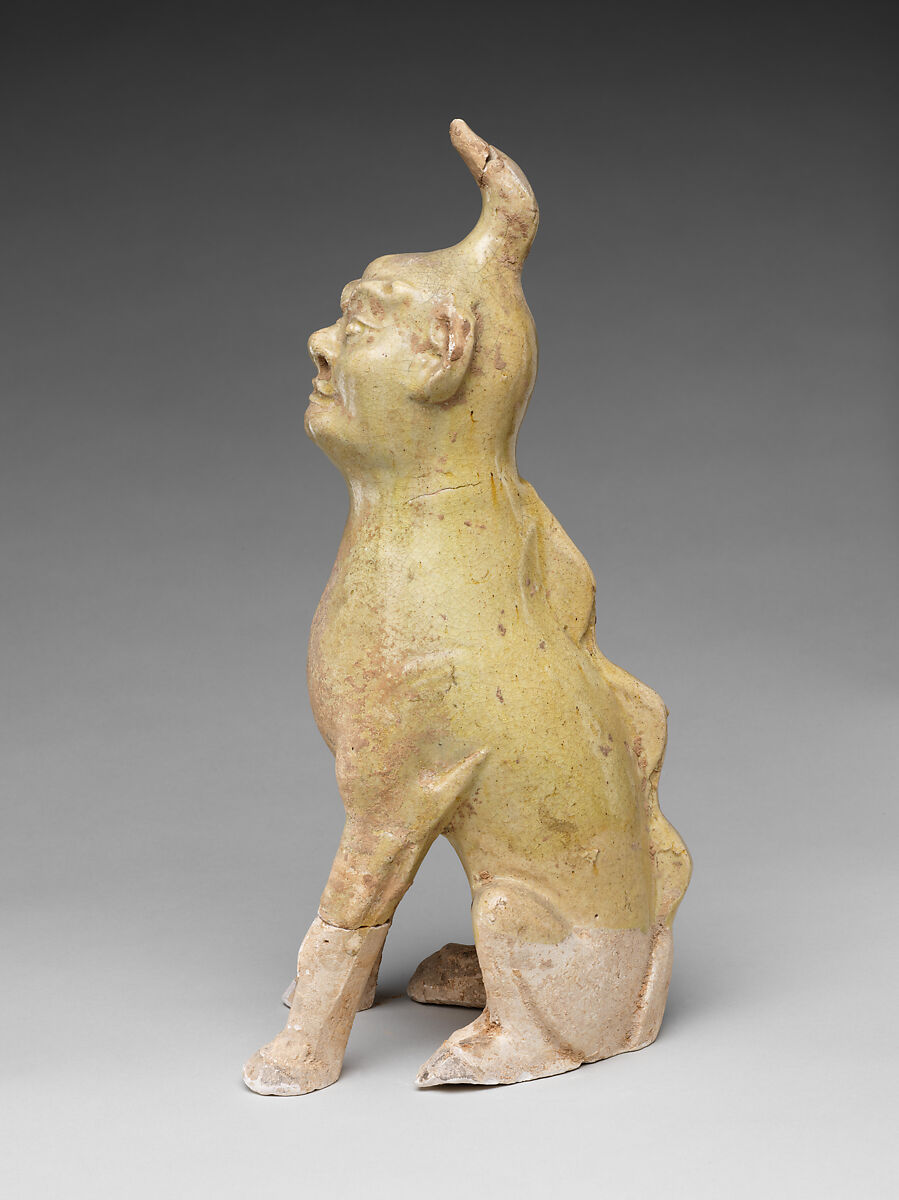 Tomb guardian beasts with dog, Earthenware with pale green glaze, China