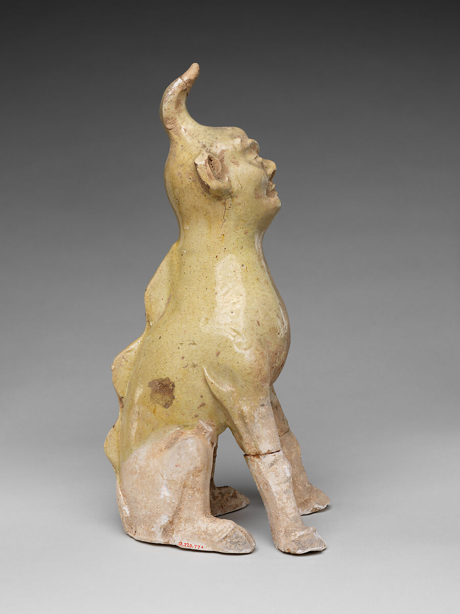 Tomb guardian beasts with dog, Earthenware with pale green glaze, China