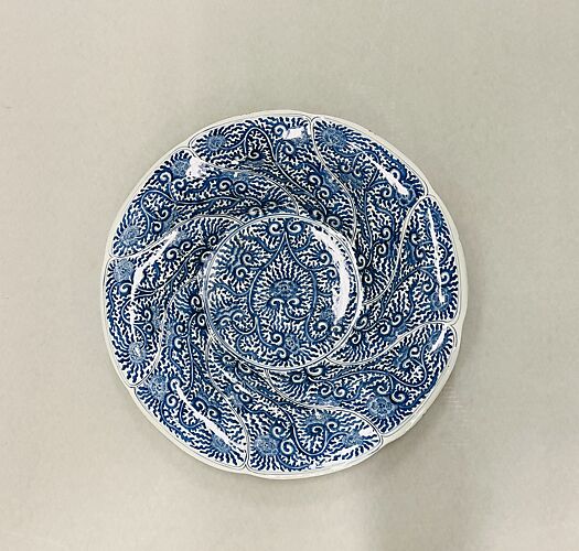 Plate with scalloped rim