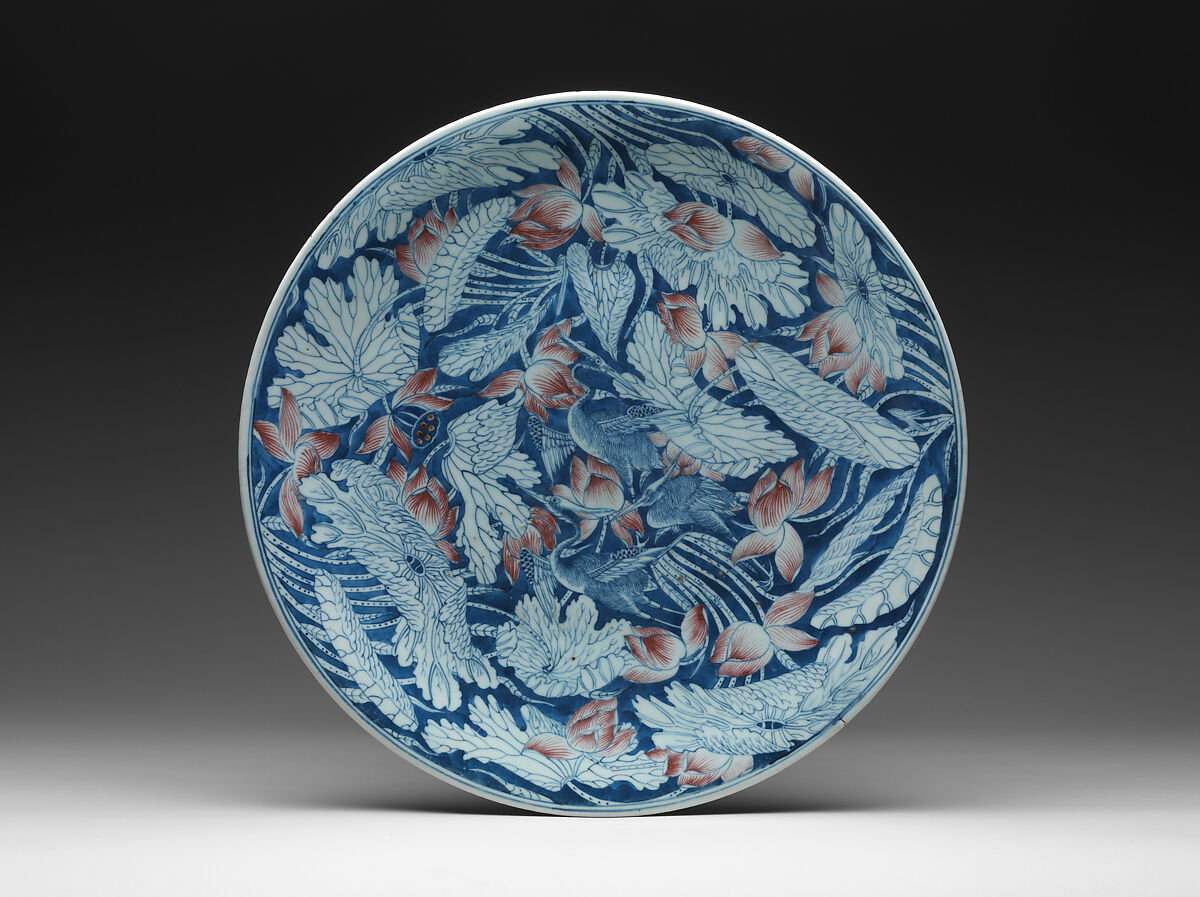 Plate with egrets in a lotus pond, Porcelain painted in underglaze cobalt blue and copper red (Jingdezhen ware), China 