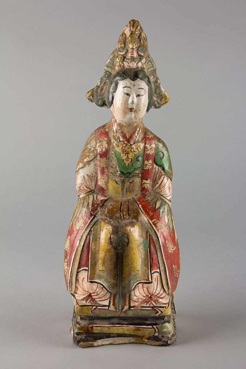 Figure of a sitting woman, Stoneware painted in overglaze polychrome enamels, China 