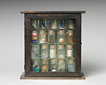Untitled (Pharmacy), Joseph Cornell  American, Box construction: wood, glass, mirror, shells, sand, printed paper, coral, cork, feather, metal, and liquid