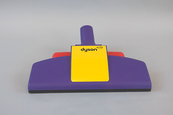 "DC02 De Stijl" Vacuum Cleaner, Sir James Dyson (British, born 1947), polycarbonate (clear plastic canister), polyethylene vinyl acetate (purple hose), acrylonitrile-butadiene-styrene / ABS (glossy red plastic), poly(vinyl chloride) /PVC (wheels), and metal