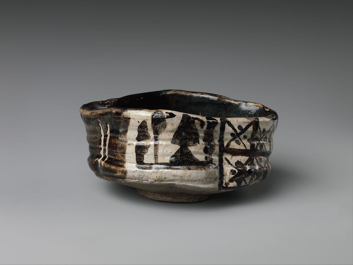 Clog-shaped tea bowl (kutsu-gata chawan) with plum blossoms and geometric patterns, Stoneware with iron-oxide decoration (Mino ware, Black Oribe type), Japan 