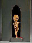 "Memento Mori" Brooch with stand from the "Thanatos Series", Bruce Metcalf (American, born Amherst, Massachusetts, 1949), Brooch: Boxwood, diamonds, 18K gold, cotton thread
Stand: Painted basswood