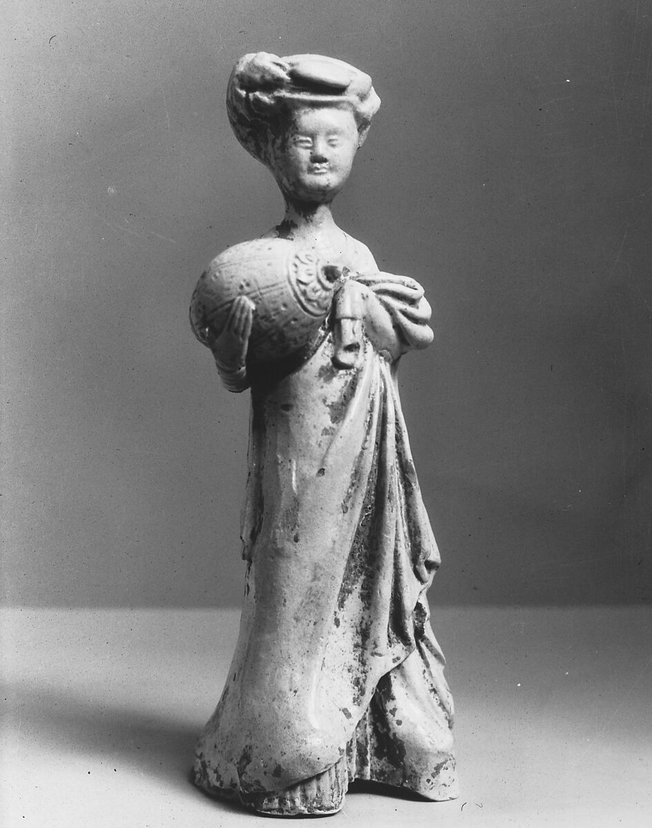 Female attendant carrying a pillow, Glazed arthenware with pigment, China 