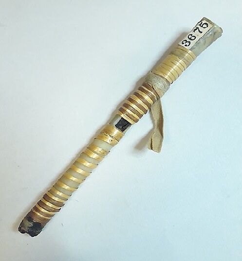 Whistle, bird bone, split bark, pitch, cloth, Native American (Siouan or Algonquian, probably)