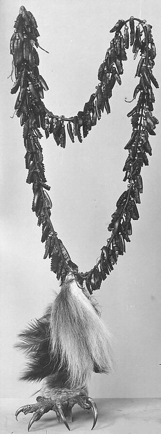 Dew Claw Strung Rattle, Dewclaws, leather, rawhide, brass, eagle's claw and feathers, deer's tail, Native American (Osage, Wazhazhe)