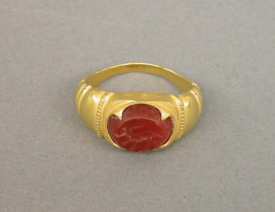Ring with Ridged Segments and Inset Red Stone, Gold with red stone, Indonesia (Java) 