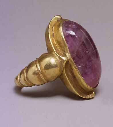 Ring with Large Purple Oval-Shaped Stone in Plain Mount