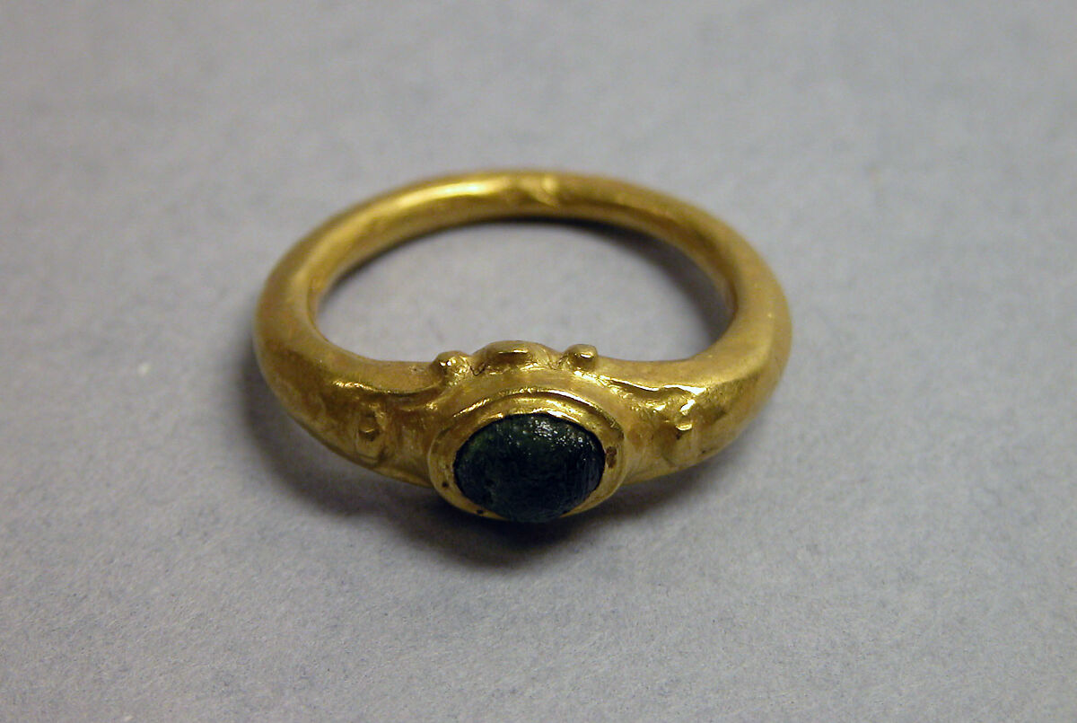 Ring with Green Stone in Circular Setting, Gold with green stone, Indonesia (Java) 