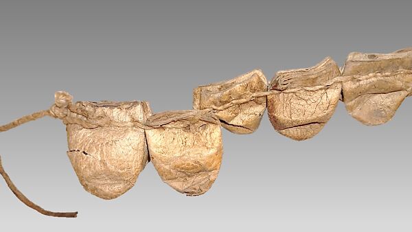 Rattle strap, Bombycid moth cocoon, leather pebbles, cotton string, Native American (Papago or Yaqui)