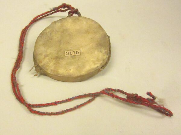 Cici'Gwan, Wood, deerskin, cord, pebbles?, yarn, Native American (Chippewa - Ojibwa) 