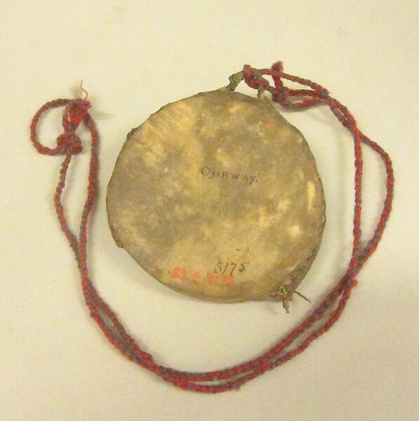 Cici'Gwan, Wood, deerskin, cord, pebbles?, yarn, Native American (Chippewa - Ojibwa)