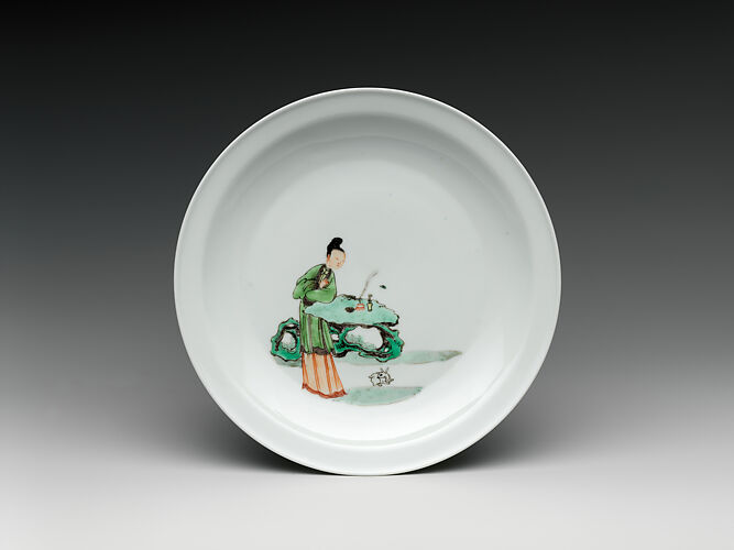 Dish with woman and rabbit in a garden
