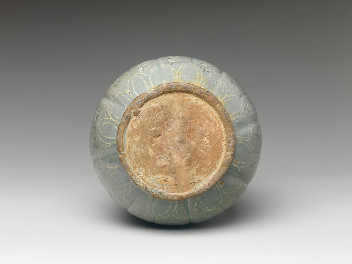 Bottle decorated with chrysanthemums and lotus petals, Stoneware with stamped and inlaid design under celadon glaze, Korea