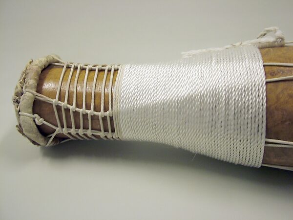 Batá, Brandon Rosser (American, active New York, late 20th century), Sweet maple, polyurethane finish, brass and copper bells, nylon, steel bolts, jet bead, deer skin heads, golden oak stain, red clay, American