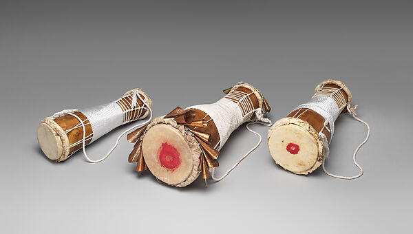 Batá, Brandon Rosser (American, active New York, late 20th century), Sweet maple, polyurethane finish, brass and copper bells, nylon, steel bolts, jet bead, deer skin heads, golden oak stain, red clay, American 