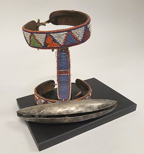 Lion Hunt Bell, Iron, glass beads, leather., Maasai