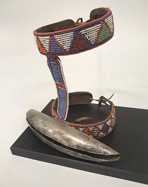 Lion Hunt Bell, Iron, glass beads, leather., Maasai