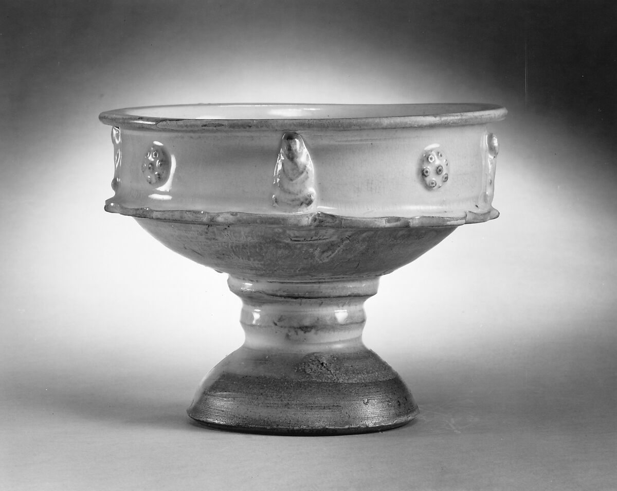 Dish on stem foot, Stoneware with appliques of buddhas and medallions and white glaze, China 