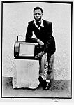 Man Leaning on Radio