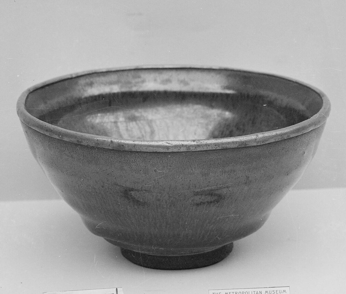 Bowl, Dark brown ware with thick black glaze streaked with brown; metal rim (Jian ware), China 