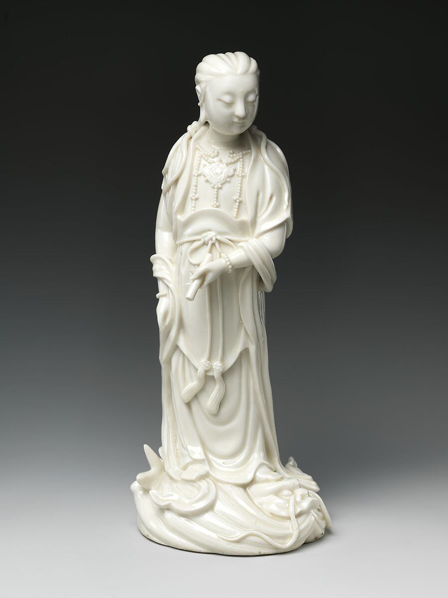 Bodhisattva Guanyin standing on a dragonfish, Porcelain with ivory glaze (Dehua ware), China 