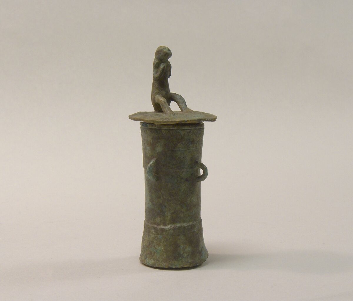 Lime Container in the Form of a "Mloko" Drum Surmounted by a Crouching Figure, Bronze, Indonesia (Java, Lumajang, Pasiran)