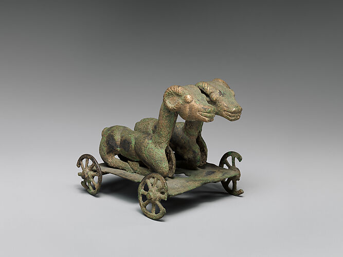 Two Rams on Wheeled Cart
