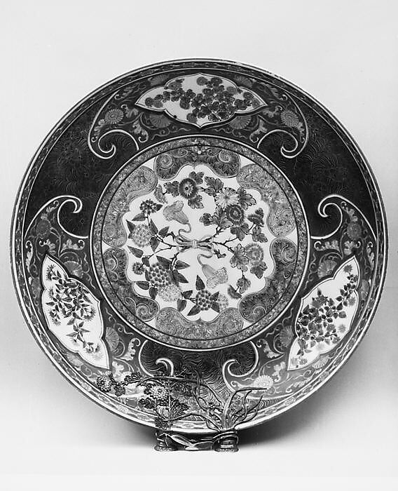 Large Dish, White porcelain with elaborate silver design to cover a repair; decorated on both sides with blue under the glaze, polychrome enamels and gold (Arita ware), Japan 