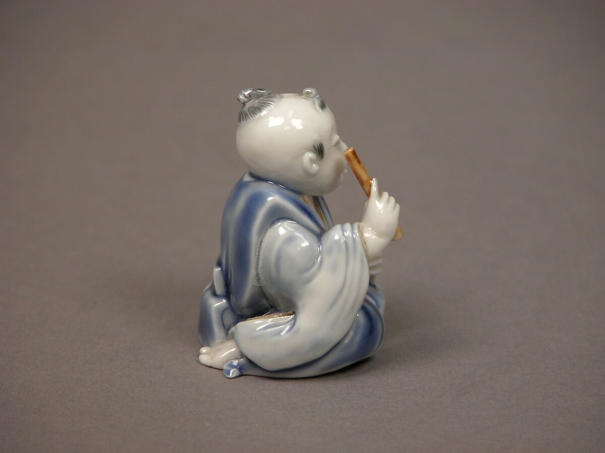 Chinese child with musical instrument, Porcelain with underglaze blue and iron decoration (Hirado ware), Japan