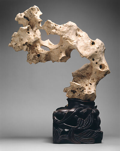Large rock with pronounced overhang and perforations