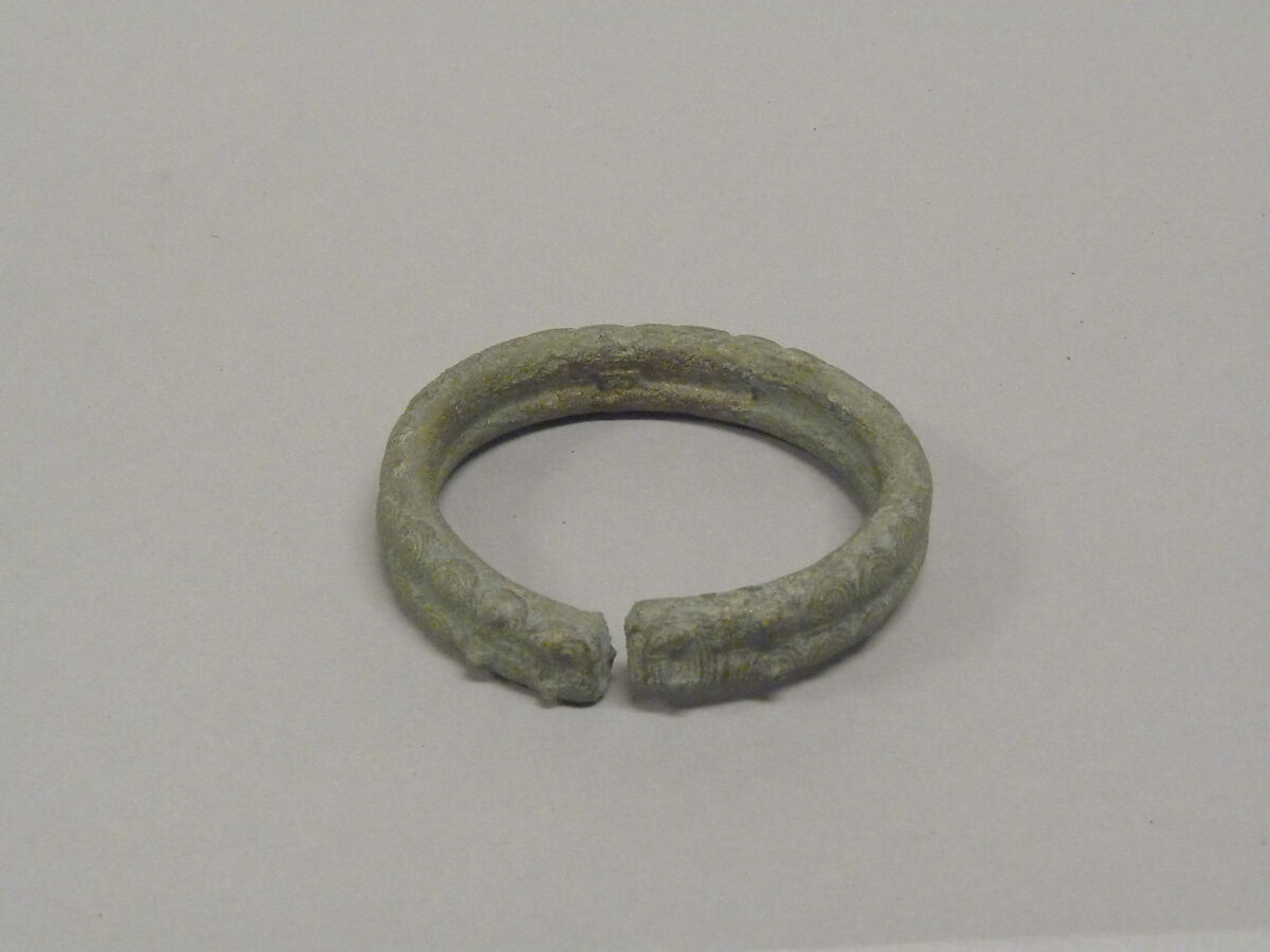 One from a Pair of Solid Open Bangles with Two Rows of Concentric Circles, Bronze, Thailand 