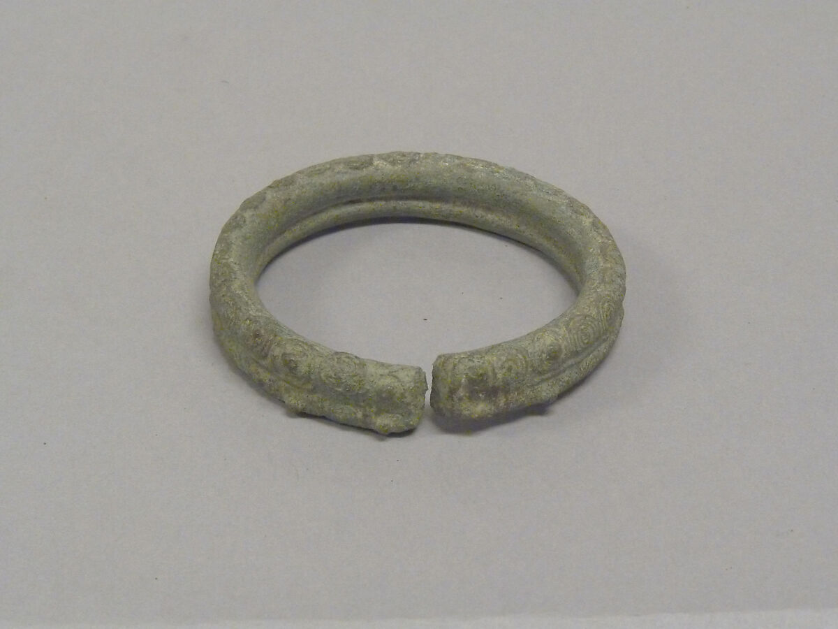 One from a Pair of Solid Open Bangles with Two Rows of Concentric Circles, Bronze, Thailand 