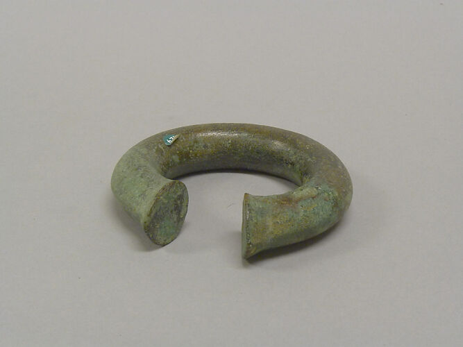 One from a Pair of Solid Open Bangles with Shaved Ends