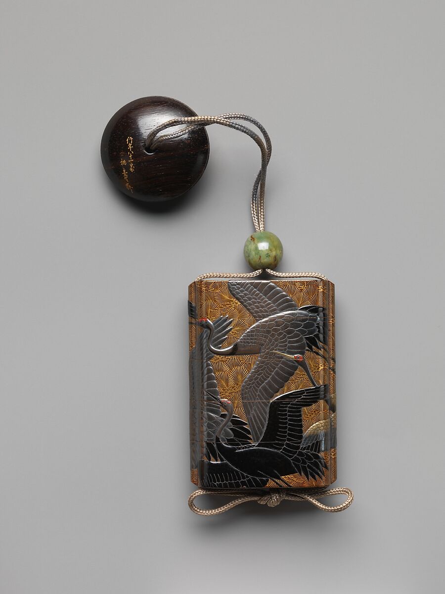 Inrō with Cranes and Pines, Koma Kyūhaku V (Japanese, died 1794), Gold togidashi lacquer ground with gold and silver takamaki-e and hiramaki-e, and black and red lacquerNetsuke: hat and mask; lacquer on wood Ojime: jade bead, Japan