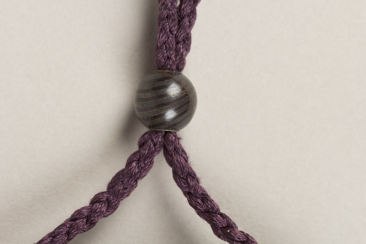 Inrō with Sanbasō Dancers, Four cases; lacquered wood with gold, silver hiramaki-e, togidashimaki-e, and cut-out gold foil on nashiji (“pear-skin”) groundNetsuke: box with mouth organ (shō) and pouch; ivory with inlaysOjime: lacquer bead, Japan