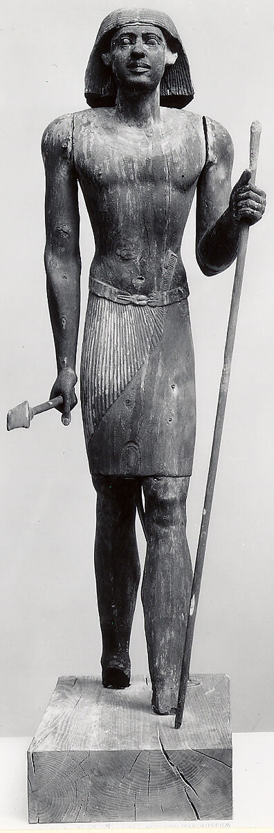 Standing Statue of Mitry with flaring wig, Acacia, paint, gesso 