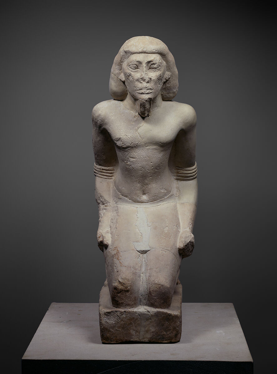 Kneeling captive, Limestone, paint