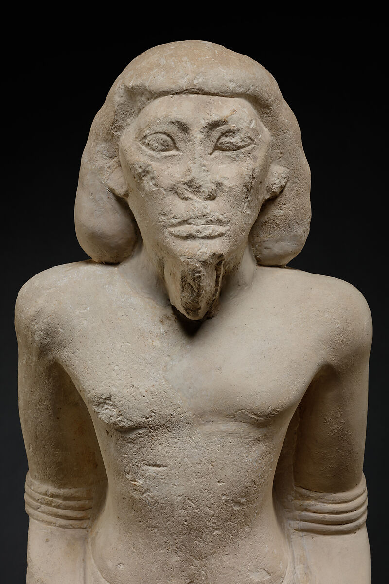 Kneeling captive, Limestone, paint