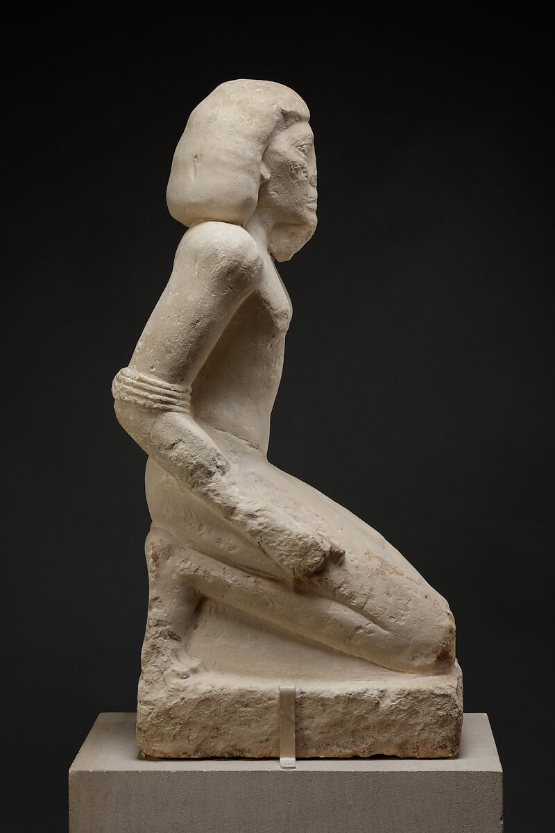 Kneeling captive, Limestone, paint