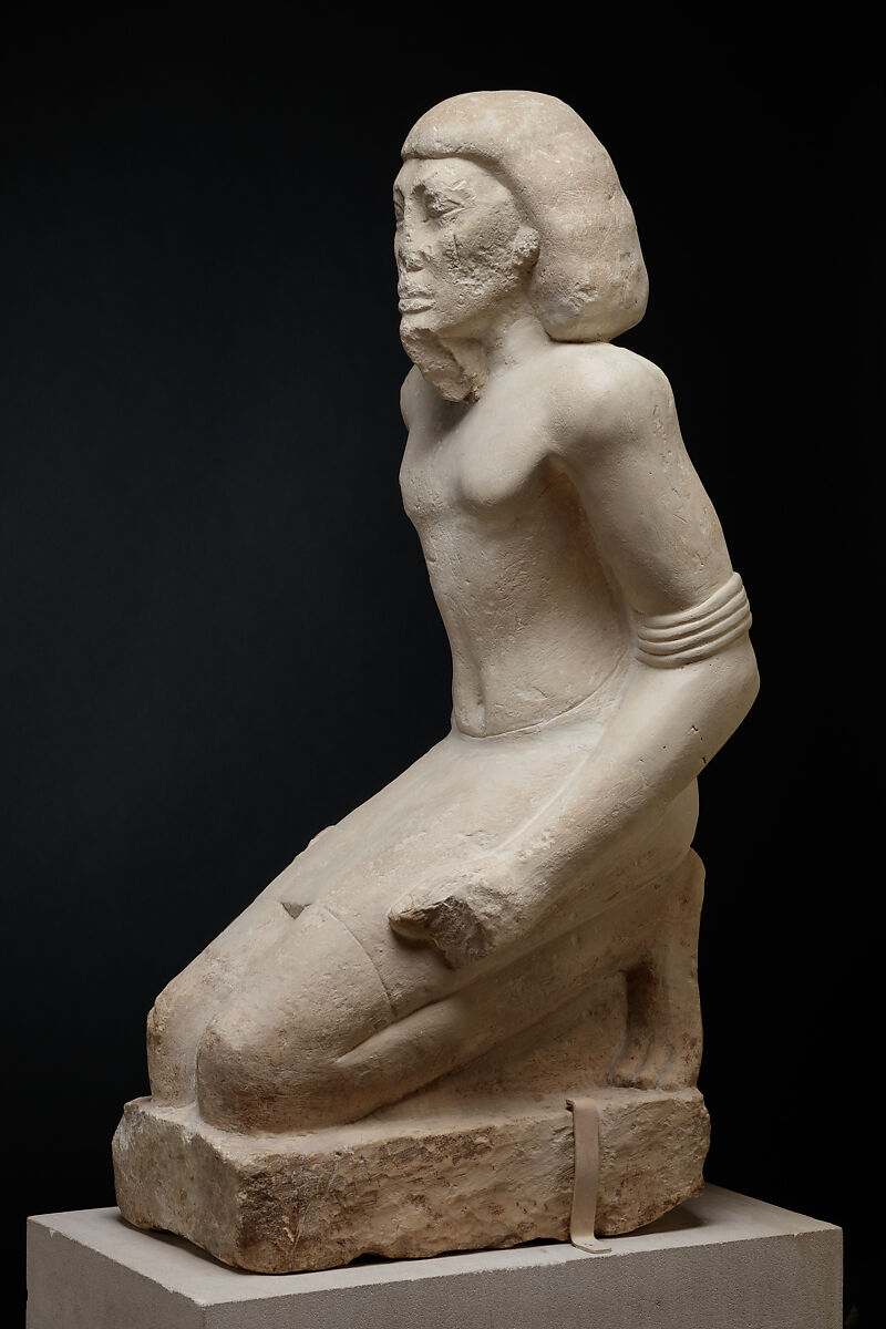 Kneeling captive, Limestone, paint