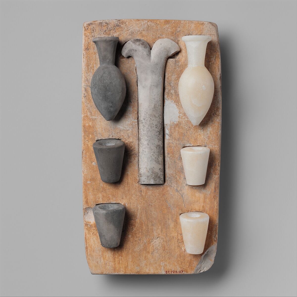 Model of the "Opening of the Mouth" ritual equipment, Tray: limestone; vessels: Travertine (Egyptian alabaster), greywacke 
