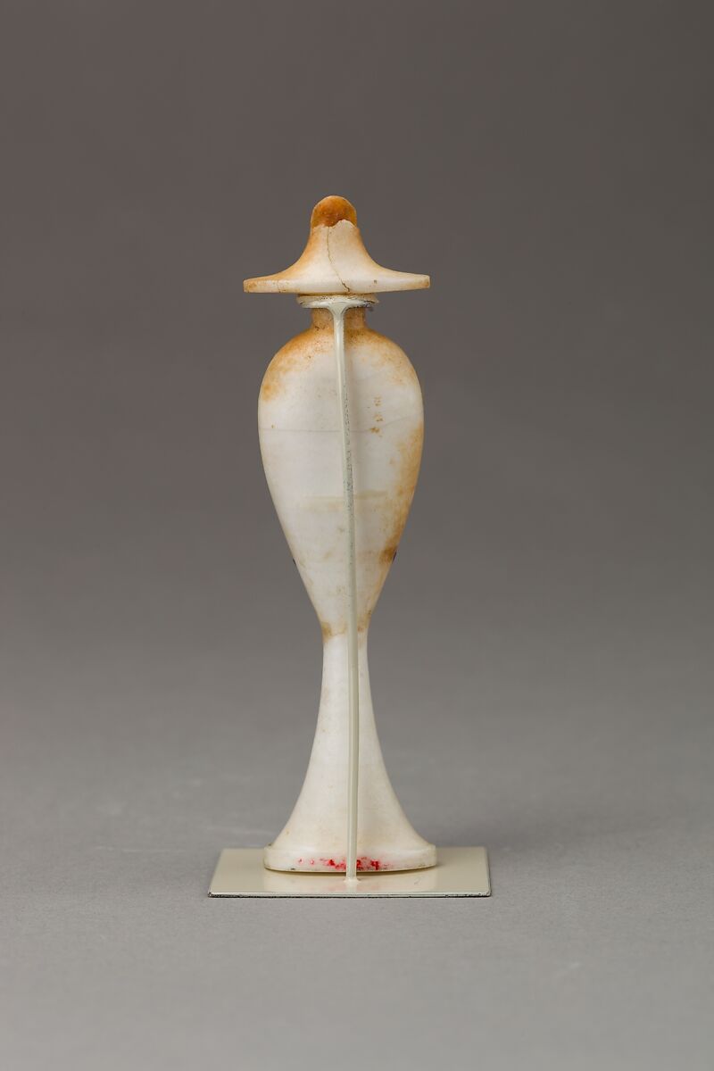 Perfume bottle in the shape of a hes-vase inlaid with the figure of a princess, Travertine (Egyptian alabaster), carnelian, obsidian,gold,  and colored glass inlay