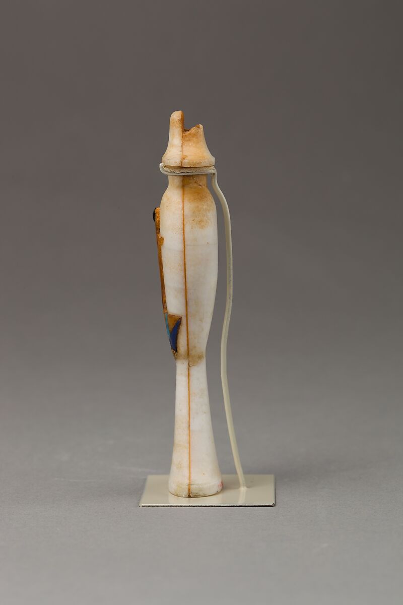 Perfume bottle in the shape of a hes-vase inlaid with the figure of a princess, Travertine (Egyptian alabaster), carnelian, obsidian,gold,  and colored glass inlay